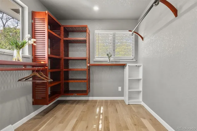 a bathroom with a sink a tub and a mirror