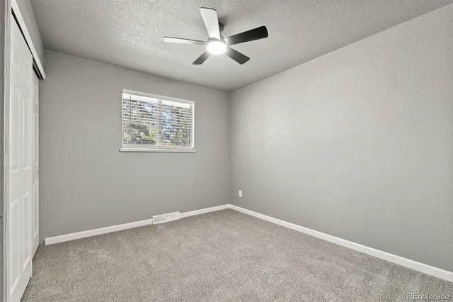 a view of an empty room with stairs