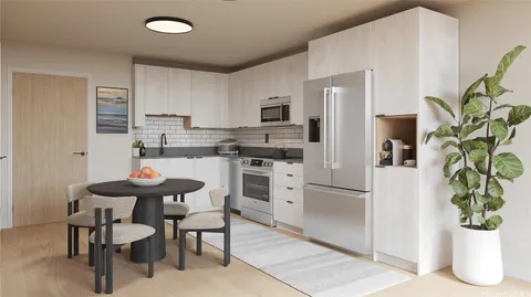 a kitchen with stainless steel appliances kitchen island a table and chairs in it