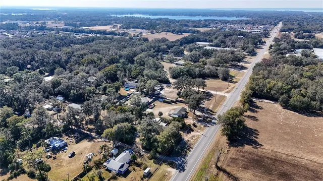 an aerial view of a city and lake view