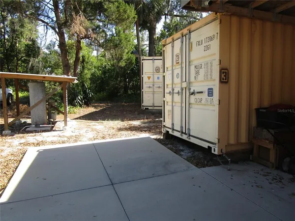 a view of a yard with trees