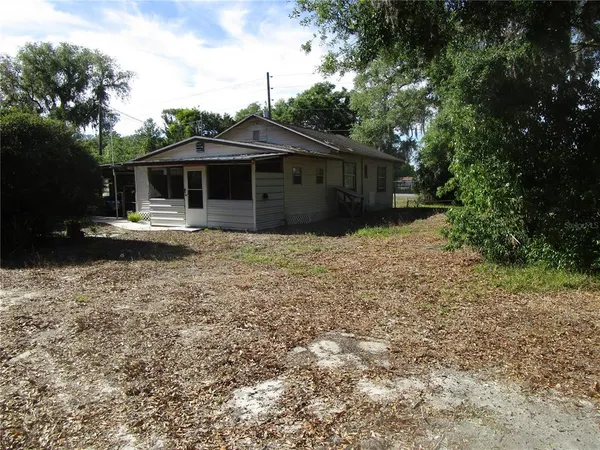 a view of a backyard of the house