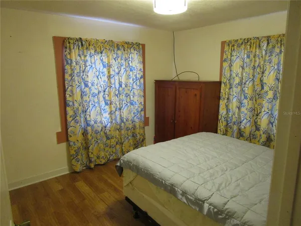 a bathroom with a sink and mirror with toilet