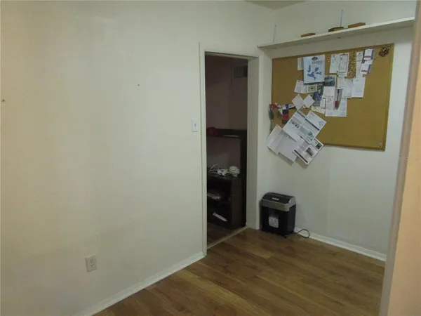 a view of entryway with wooden floor