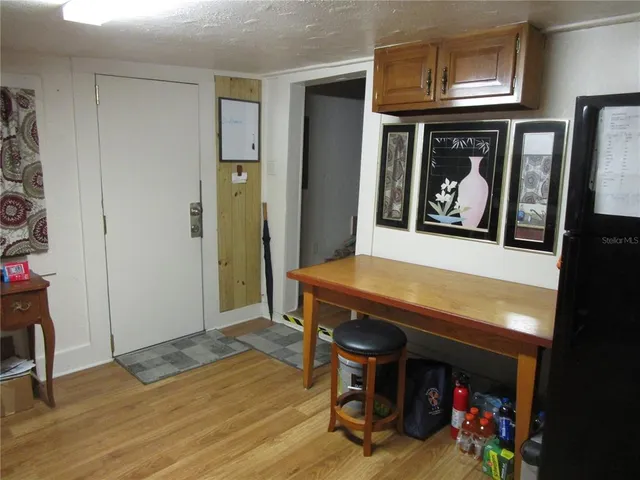 a bedroom with a bed and a mirror