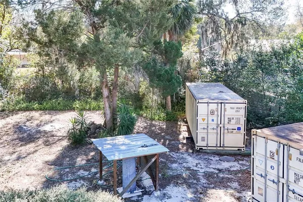 an aerial view of a houses with street