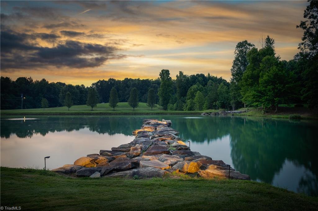 7582 Dubach Road Summerfield, NC 27358 - Photo 3 of 47 Twilight is special on this beautiful property. The pond as aerators to keep it clean.