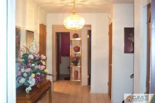 36 Meredith Road Piscataway, NJ 08854 - Photo 2 of 8 a very nice looking room with a chandelier