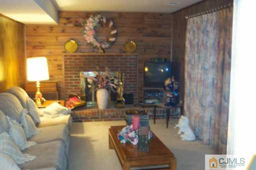 36 Meredith Road Piscataway, NJ 08854 - Photo 3 of 8 a living room with fireplace furniture and a fireplace