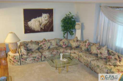 36 Meredith Road Piscataway, NJ 08854 - Photo 4 of 8 a living room with furniture and a painting on the wall