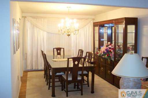 36 Meredith Road Piscataway, NJ 08854 - Photo 5 of 8 a view of a dining room with furniture and wooden floor