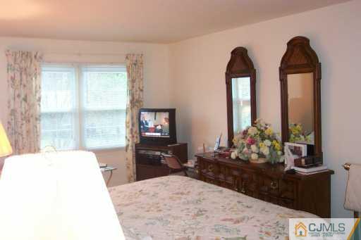 36 Meredith Road Piscataway, NJ 08854 - Photo 7 of 8 a living room with furniture and a flat screen tv