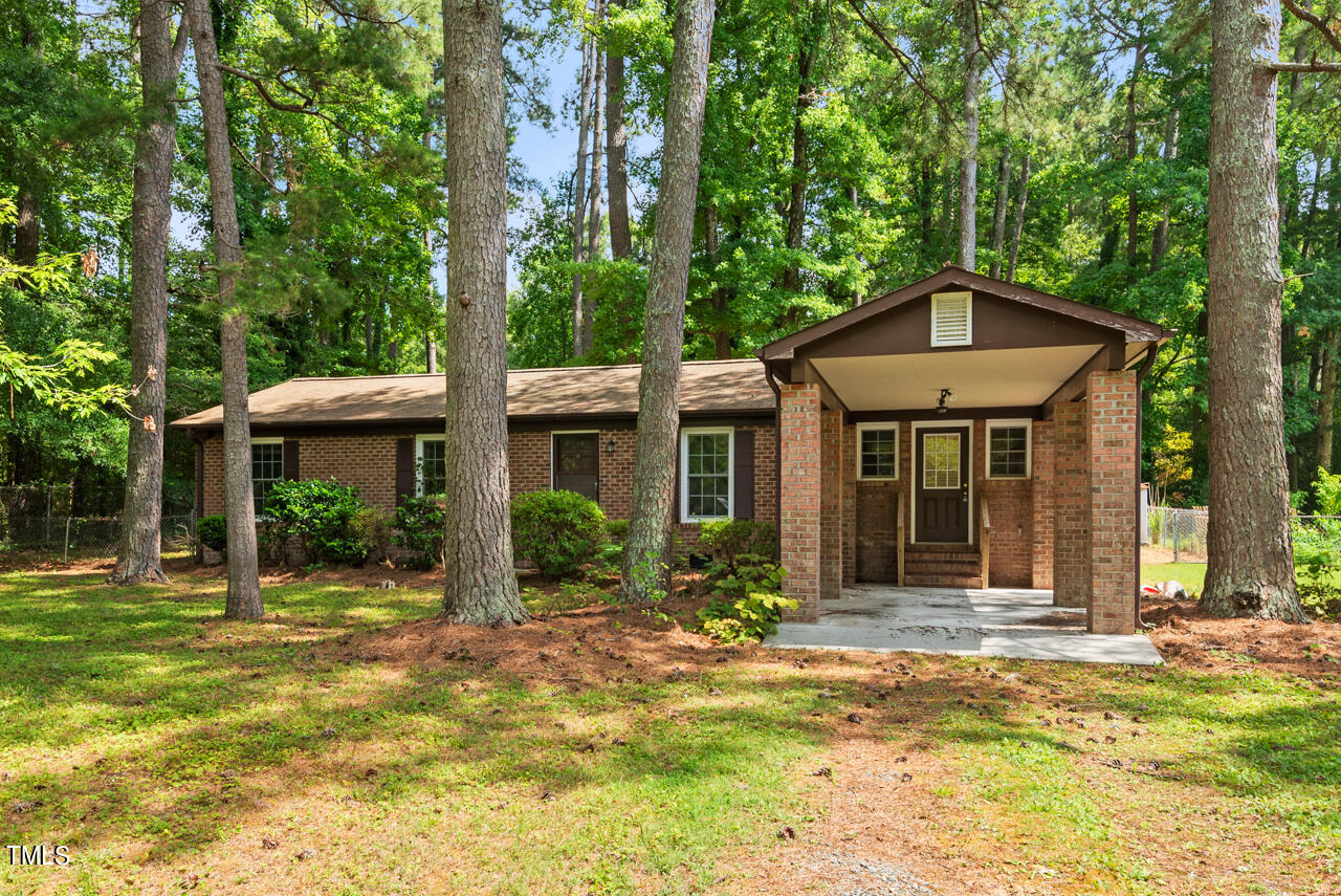 905 Spruce Pine Trail Durham, NC 27705 - Photo 1 of 6 a front view of a house with a yard