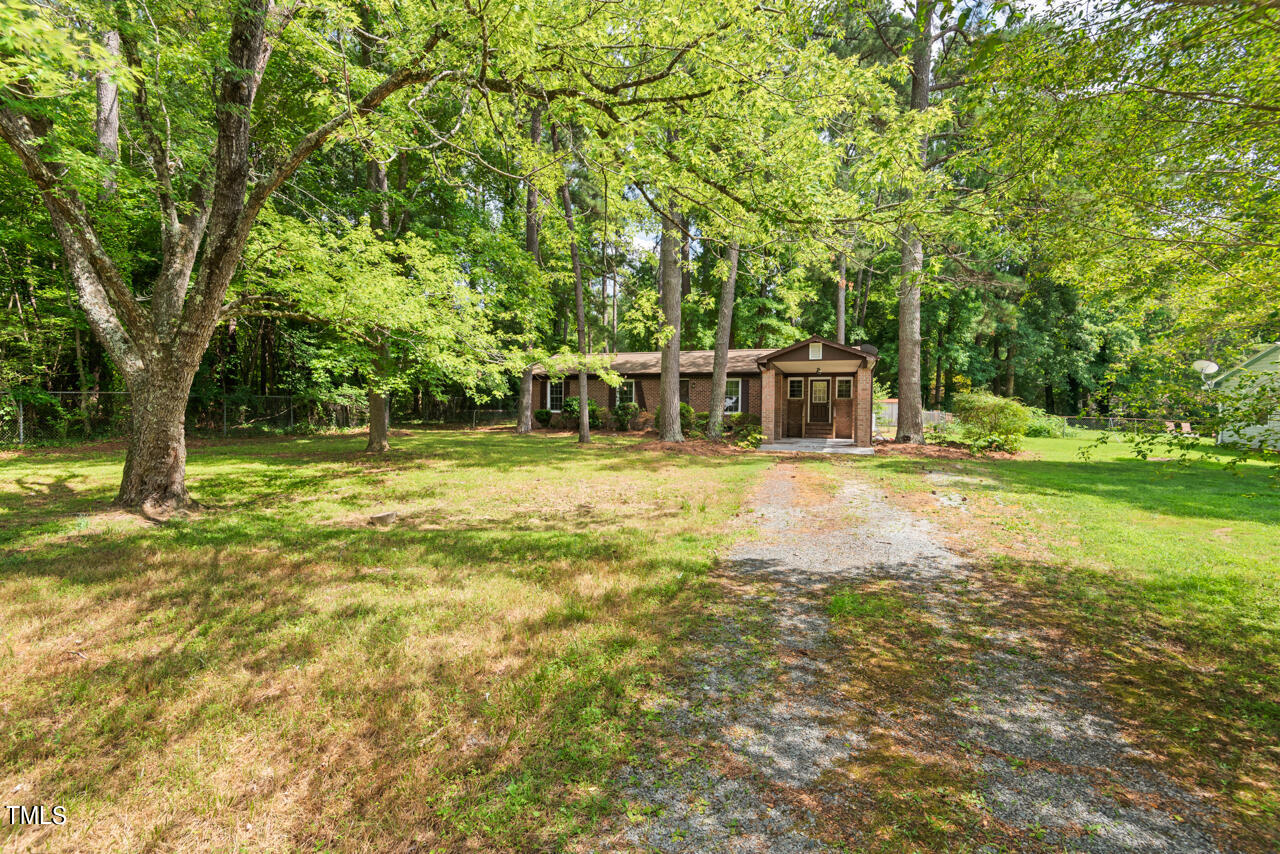 905 Spruce Pine Trail Durham, NC 27705 - Photo 3 of 6 a view of a house with a yard