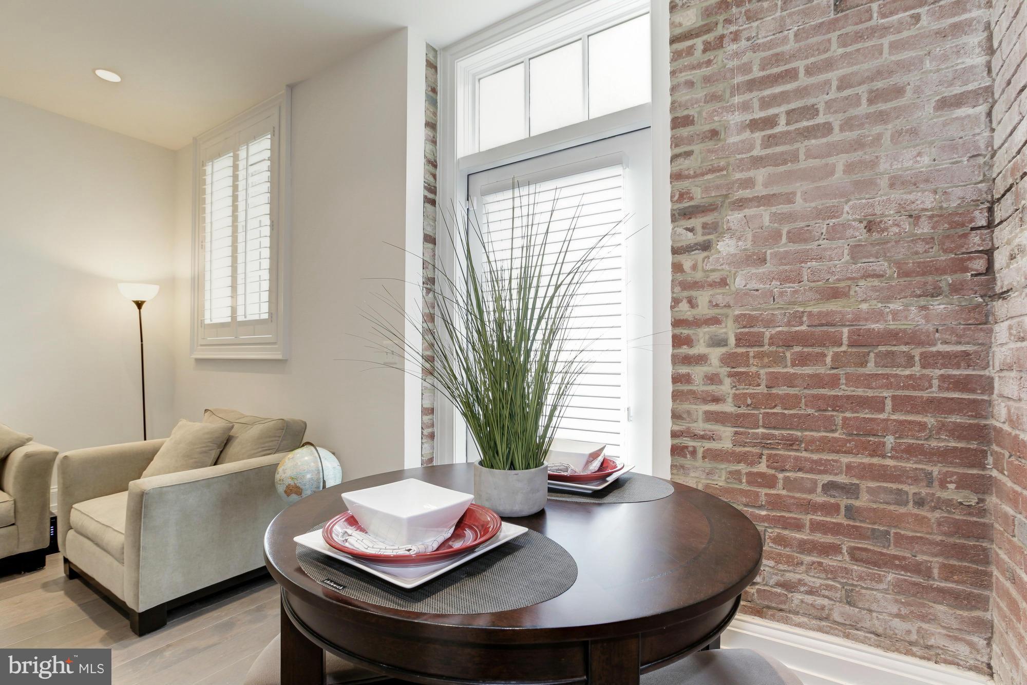 901 D Street Northeast, Unit 4 Washington, DC 20002 - Photo 14 of 25 Dining Room with Exposed Brick Walls