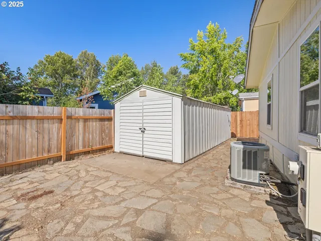 a view of a garage with a house