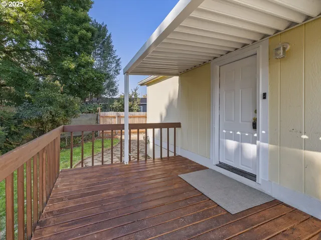 a balcony with wooden floor