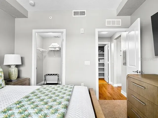 a bedroom with a bed and a dresser