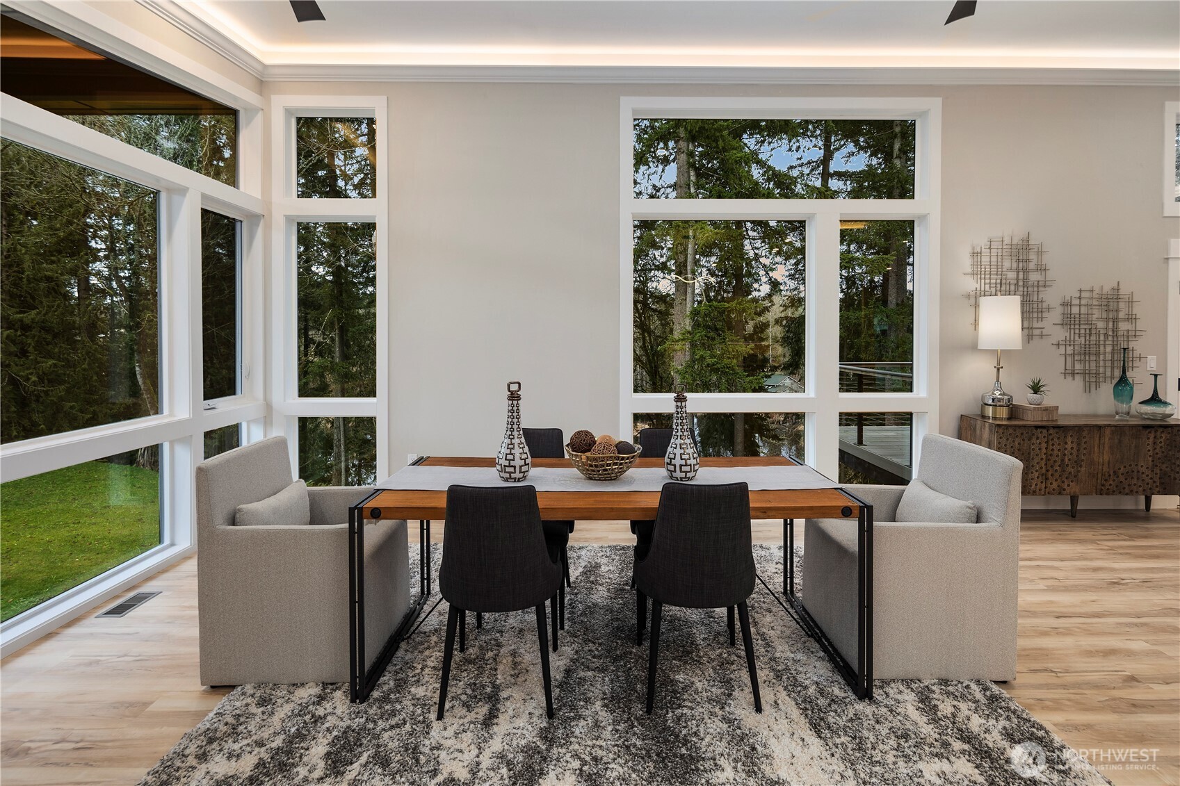 16250 Southeast Lake Moneysmith Road Auburn, WA 98092 - Photo 13 of 40 a view of a dining room with furniture large windows and wooden floor