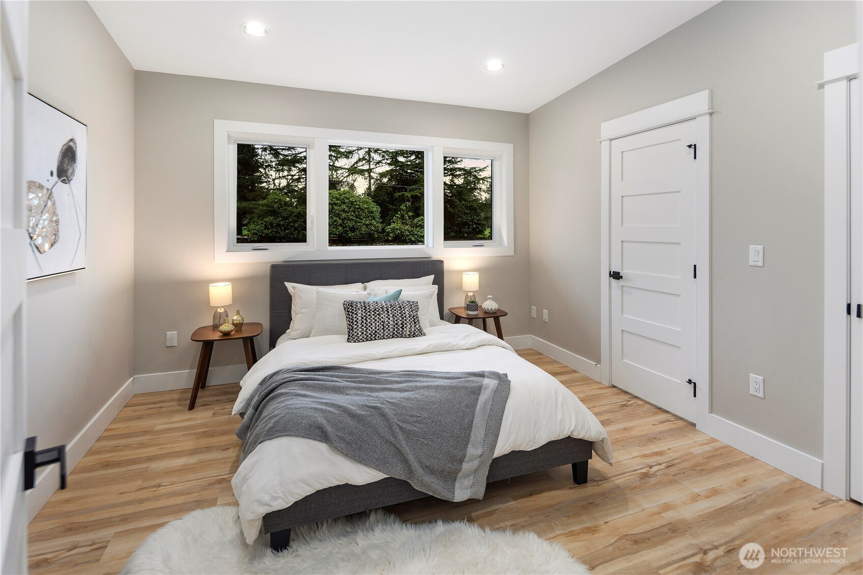 16250 Southeast Lake Moneysmith Road Auburn, WA 98092 - Photo 15 of 40 a bedroom with a bed and a large window