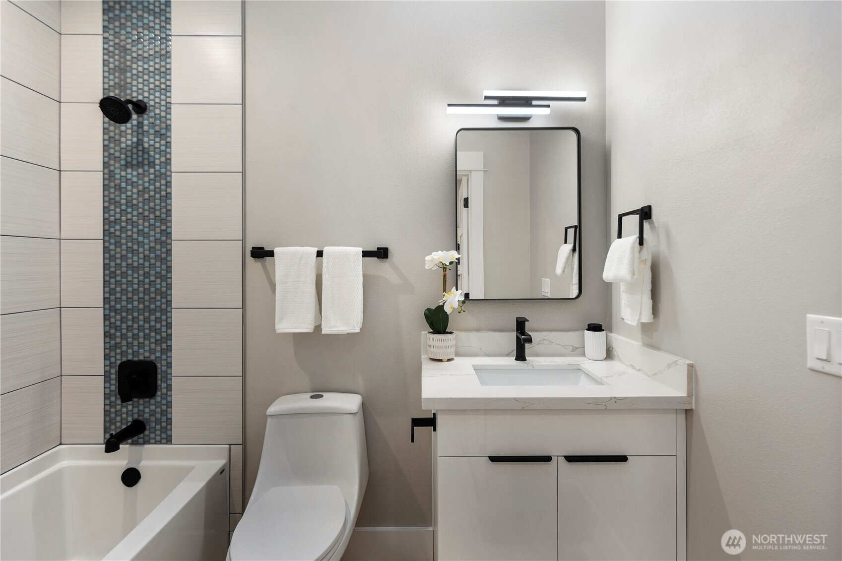16250 Southeast Lake Moneysmith Road Auburn, WA 98092 - Photo 16 of 40 a bathroom with a sink mirror toilet and bathtub