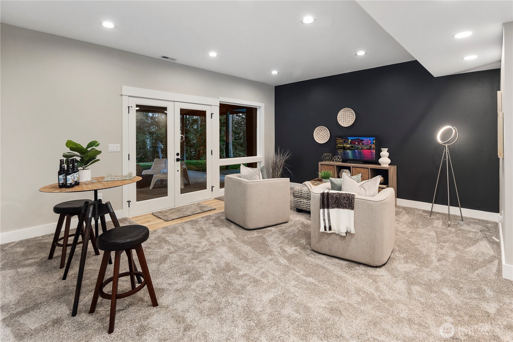 16250 Southeast Lake Moneysmith Road Auburn, WA 98092 - Photo 26 of 40 a living room with furniture a dining table and a large window with outer view
