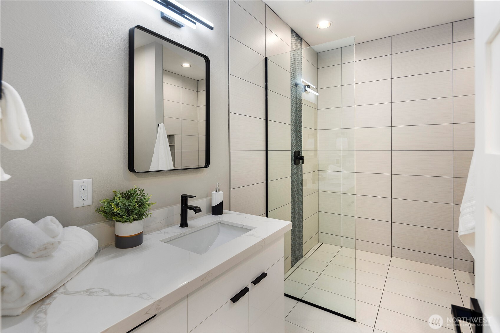 16250 Southeast Lake Moneysmith Road Auburn, WA 98092 - Photo 29 of 40 a bathroom with a sink a mirror and a shower