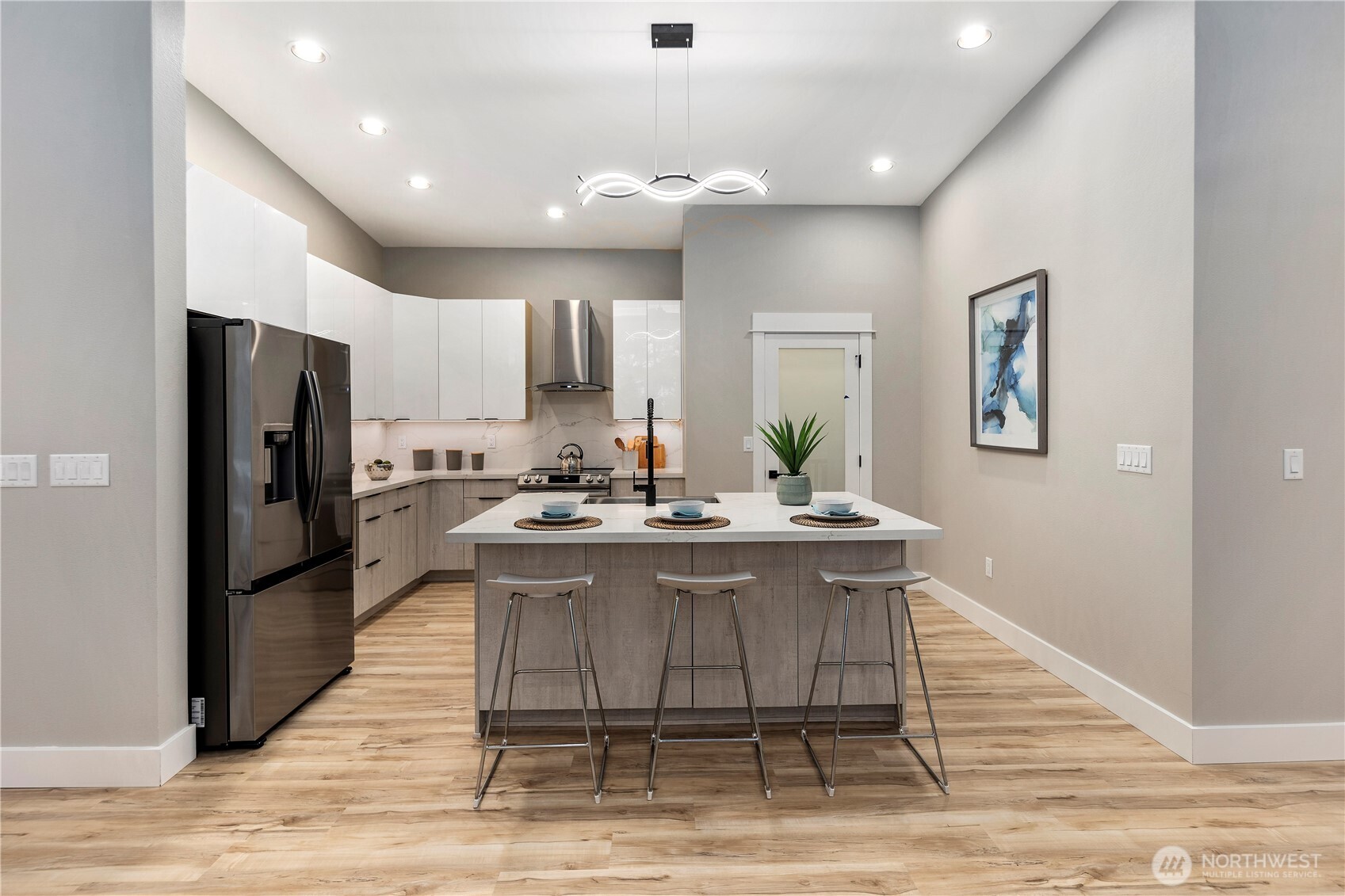 16250 Southeast Lake Moneysmith Road Auburn, WA 98092 - Photo 8 of 40 a view of a kitchen with kitchen island a refrigerator stove a sink dishwasher and wooden cabinets
