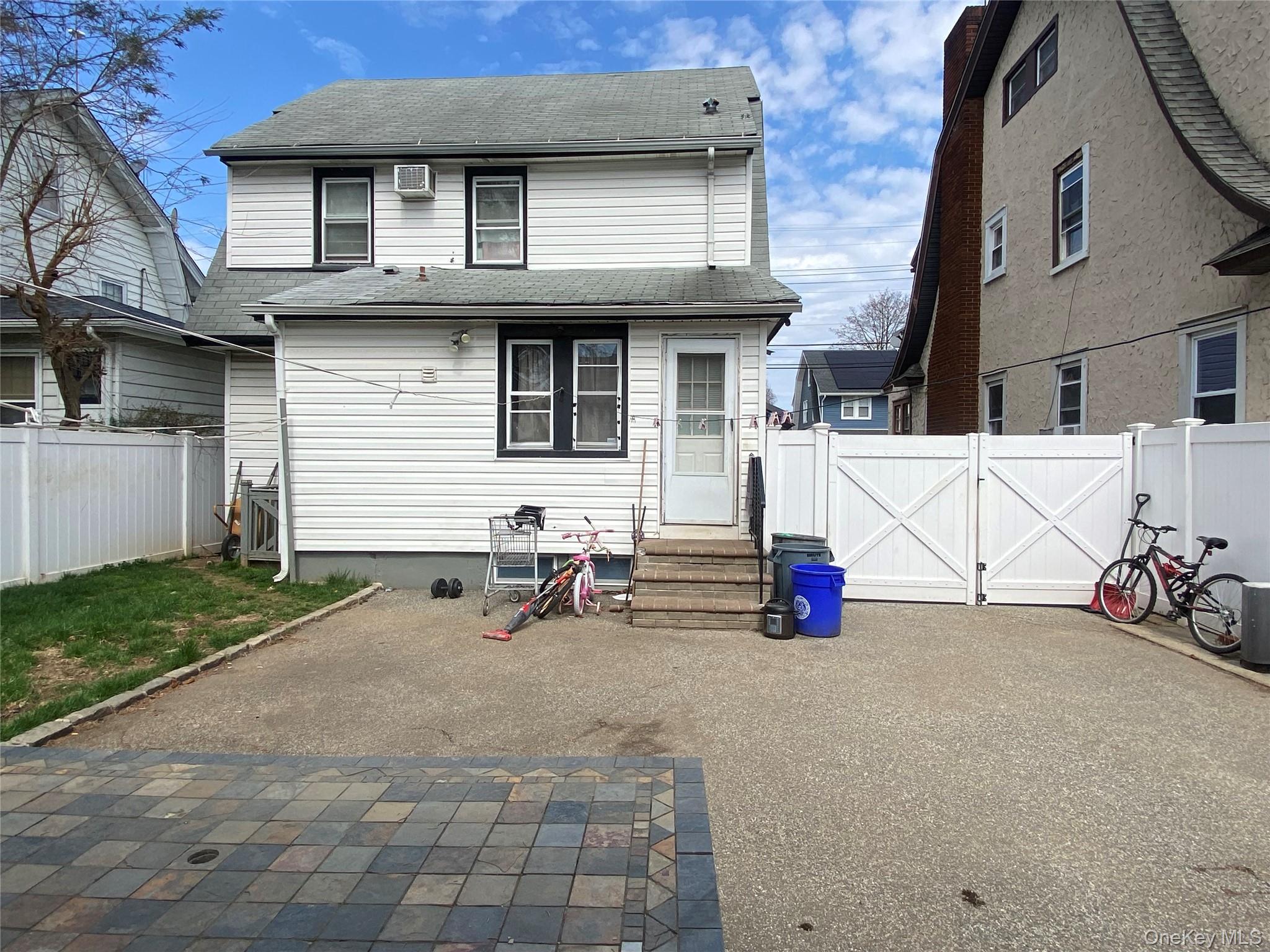 24 Lent Avenue Hempstead, NY 11550 - Photo 14 of 14 a view of a house with patio