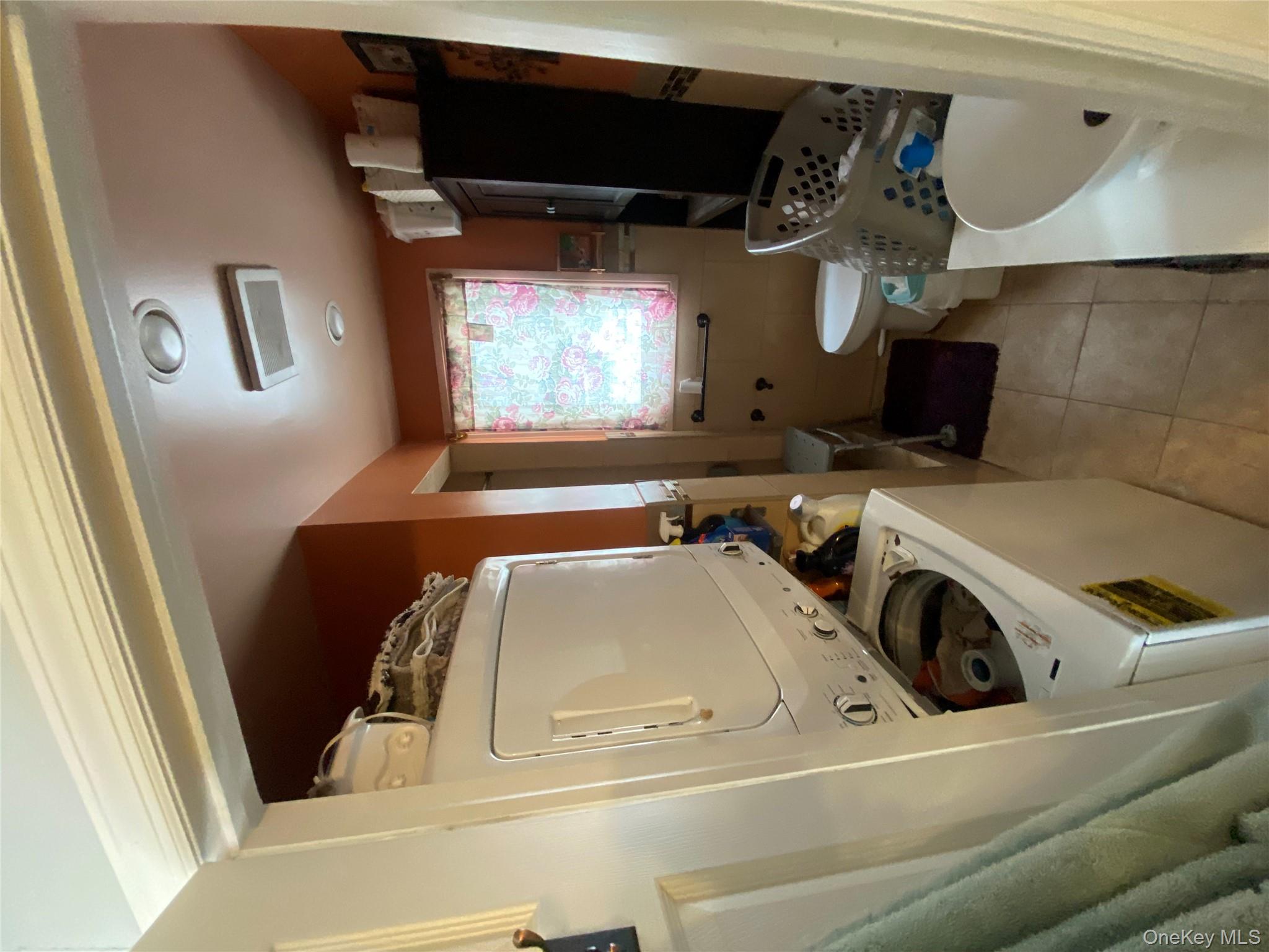 24 Lent Avenue Hempstead, NY 11550 - Photo 5 of 14 a bathroom with a sink a toilet and a bathtub