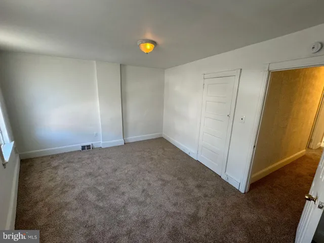 a view of an empty room and window