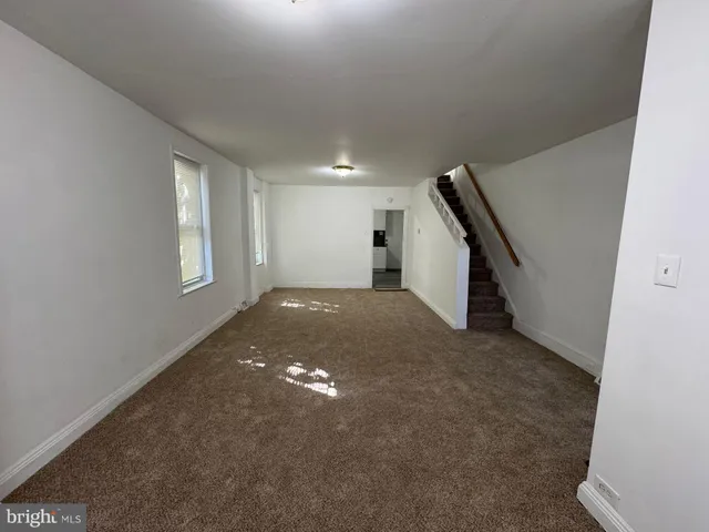 a view of a livingroom with a staircase