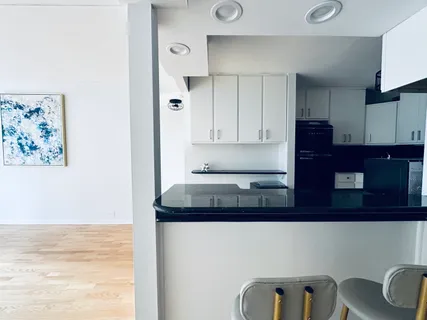 a kitchen with a cabinets and appliances