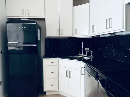a kitchen with a sink and cabinets