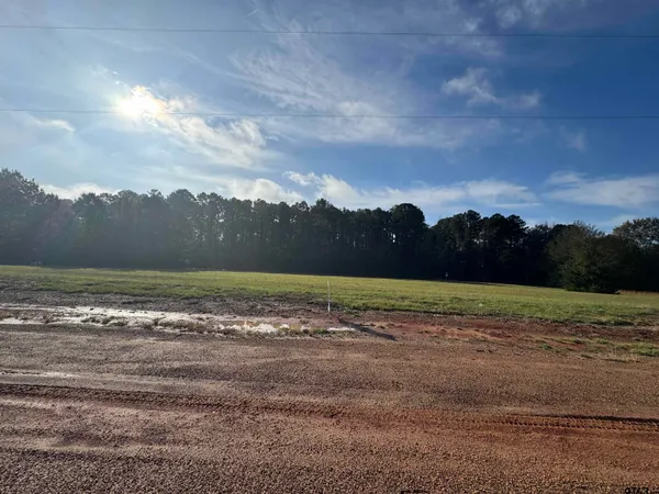 a view of dirt yard with mountain view
