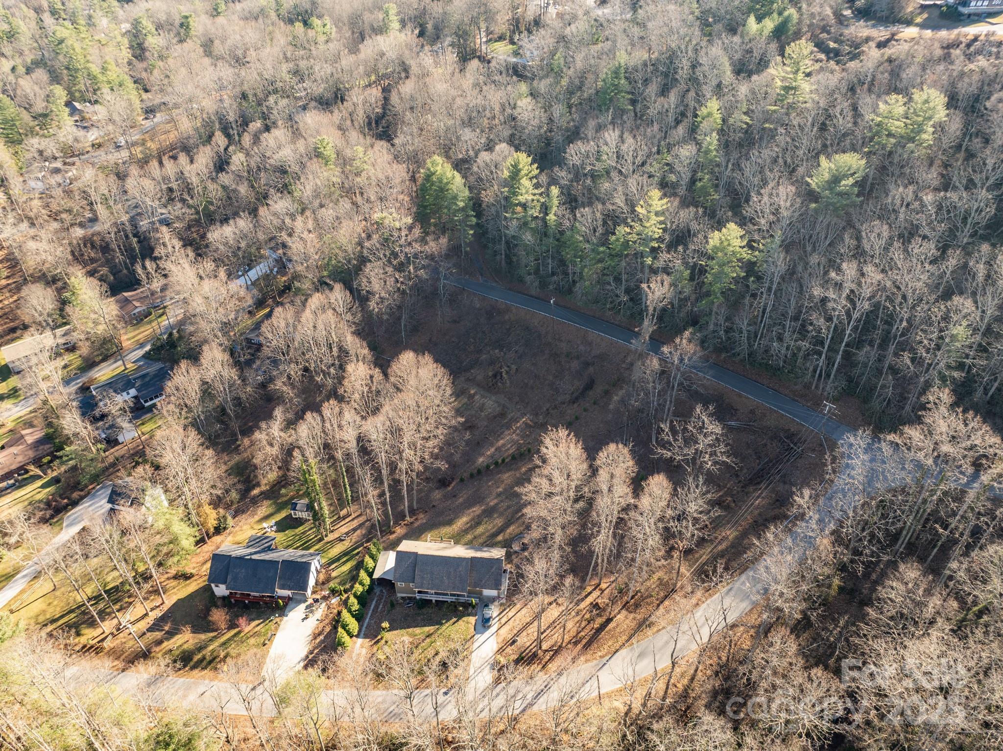 Tbd Davis Mountain Road Hendersonville, NC 28739 - Photo 6 of 10 a backyard of a house with a yard and outdoor seating