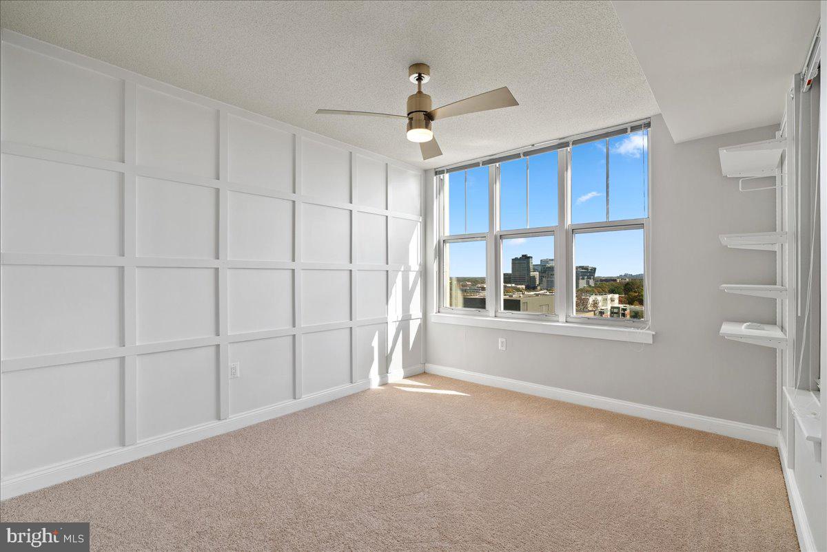 11760 Sunrise Valley Drive, Unit 909 Reston, VA 20191 - Photo 11 of 20 a view of a livingroom with an empty space and a window