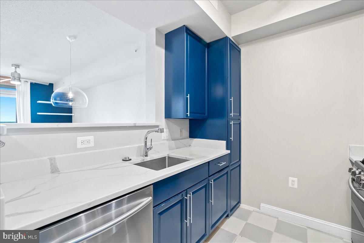 11760 Sunrise Valley Drive, Unit 909 Reston, VA 20191 - Photo 3 of 20 a bathroom with a sink and a mirror