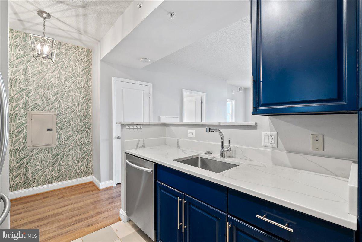 11760 Sunrise Valley Drive, Unit 909 Reston, VA 20191 - Photo 5 of 20 a bathroom with a sink and a mirror