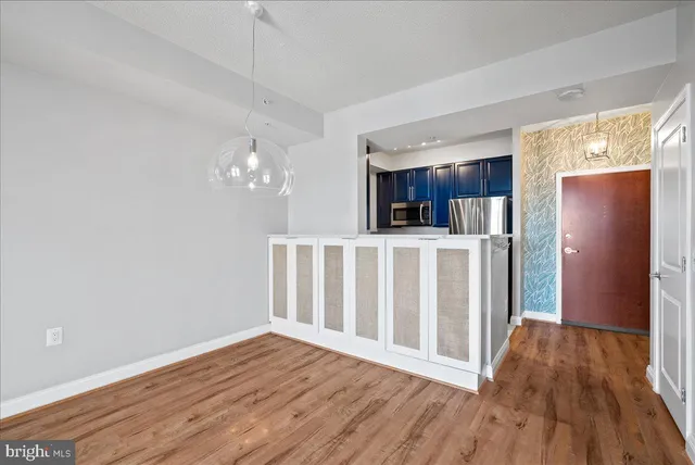 a view of kitchen with wooden floor and window