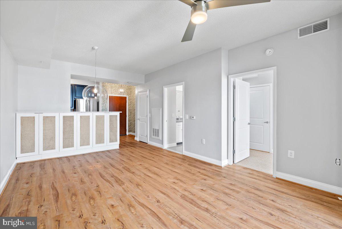 11760 Sunrise Valley Drive, Unit 909 Reston, VA 20191 - Photo 9 of 20 a view of a livingroom with wooden floor