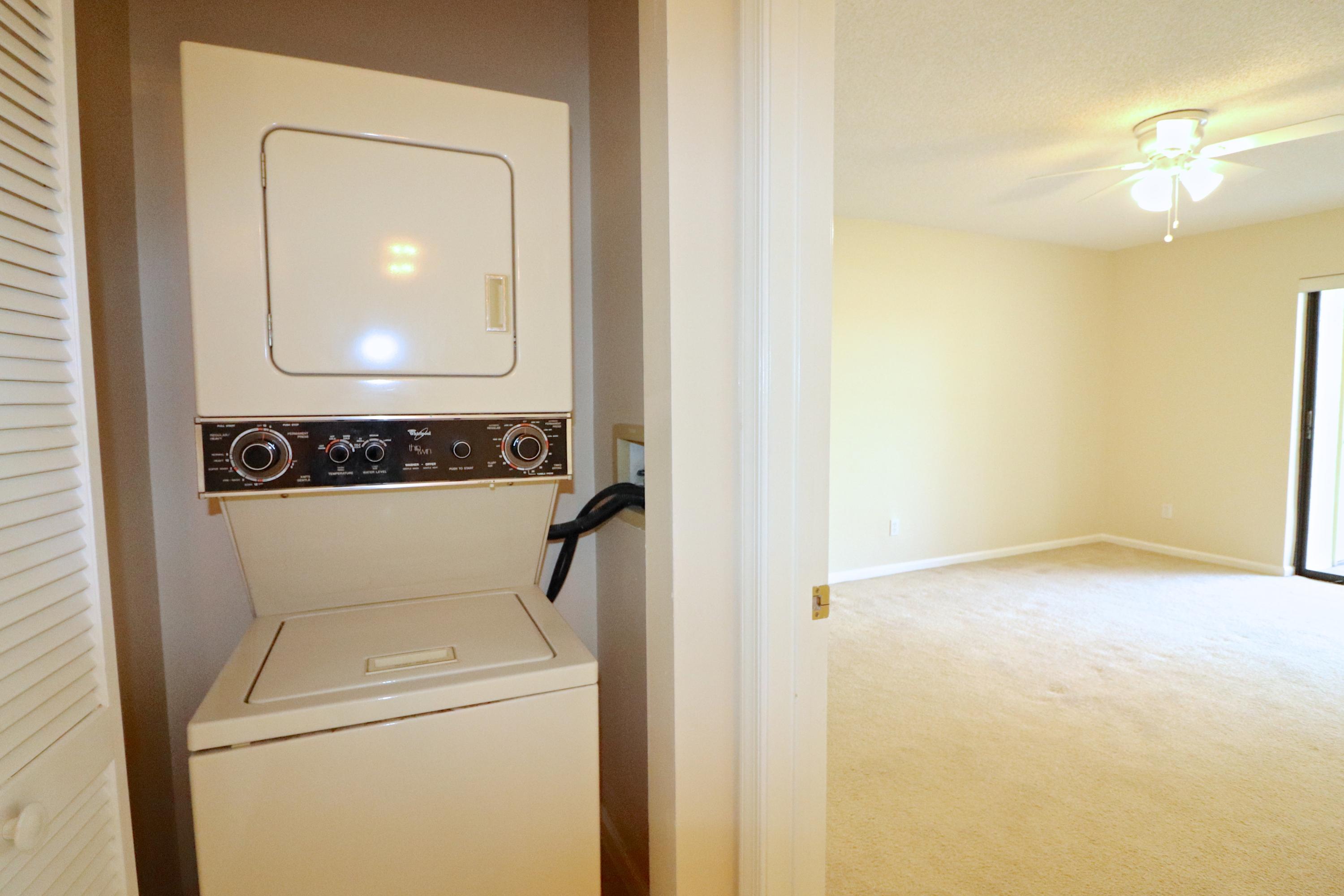 1112 Keystone Drive, Unit C Jupiter, FL 33458 - Photo 16 of 34 Laundry and Master Bedroom