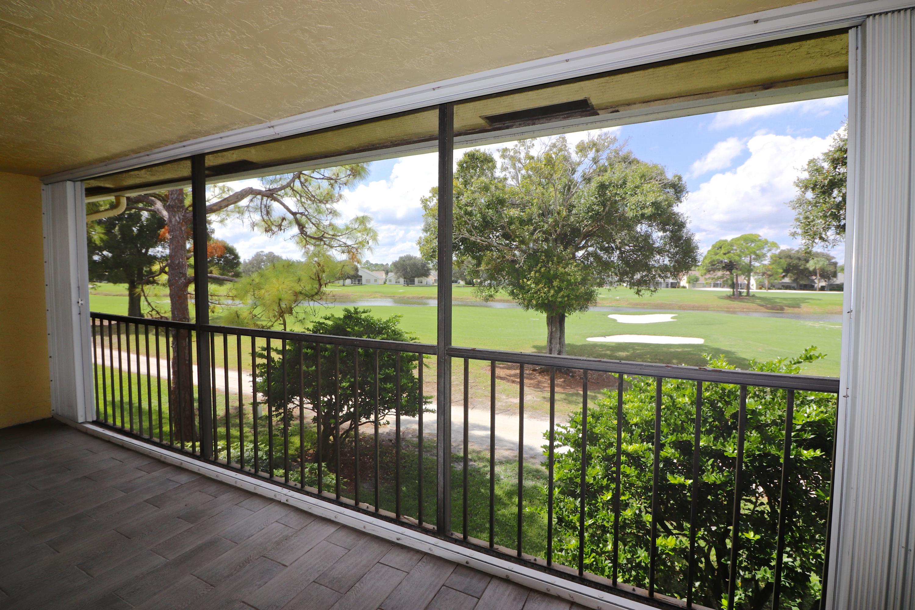 1112 Keystone Drive, Unit C Jupiter, FL 33458 - Photo 18 of 34 Patio/Golf Course