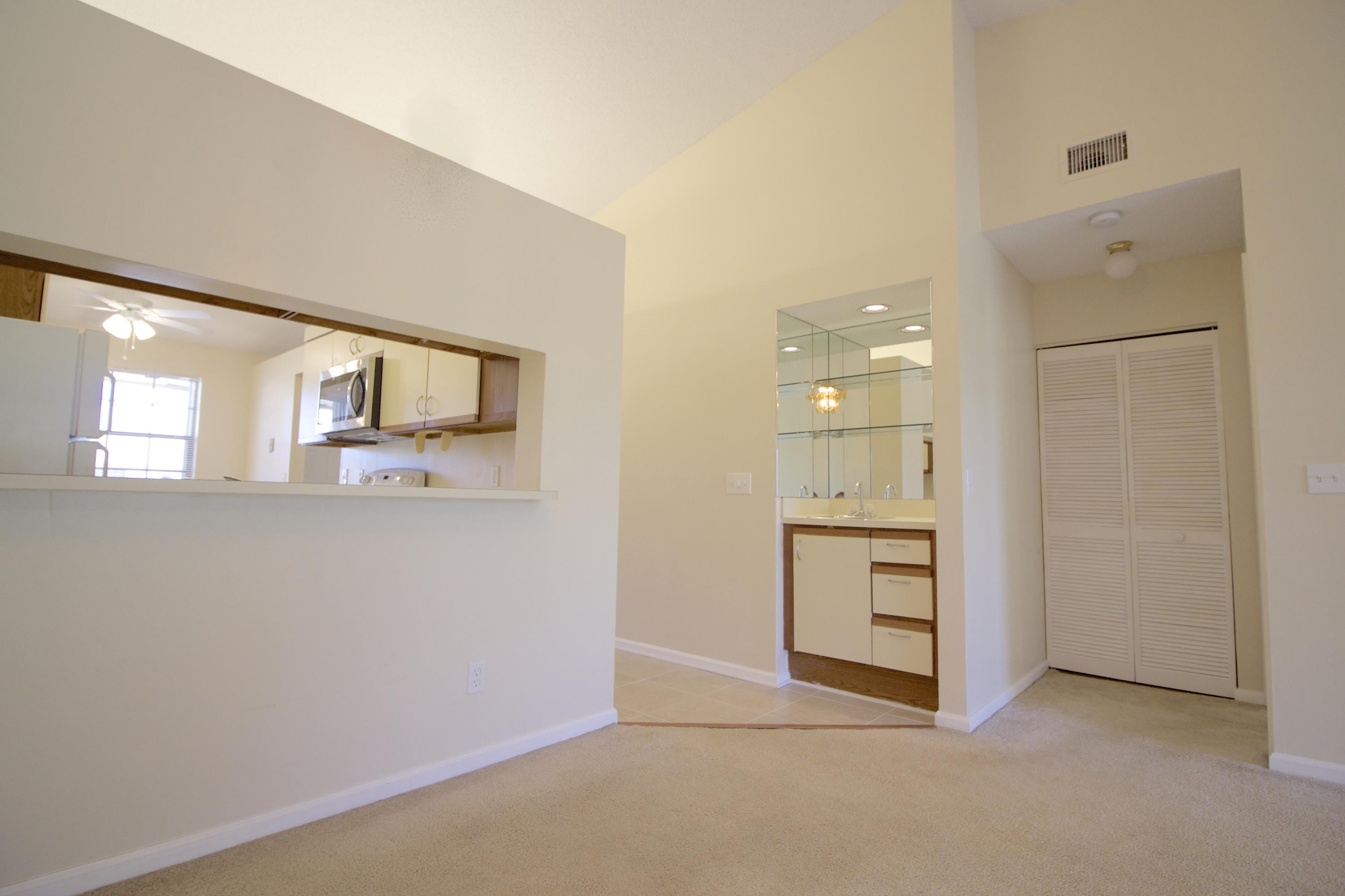 1112 Keystone Drive, Unit C Jupiter, FL 33458 - Photo 8 of 34 Pass Through from Dining Area