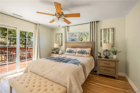 a bedroom with a large bed and a window