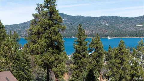 an aerial view of a house with outdoor space and street view