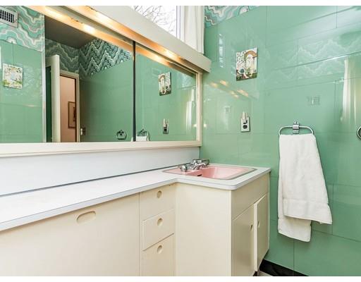 44 Mignon Road Newton, MA 02465 - Photo 16 of 23 a bathroom with a sink and mirror