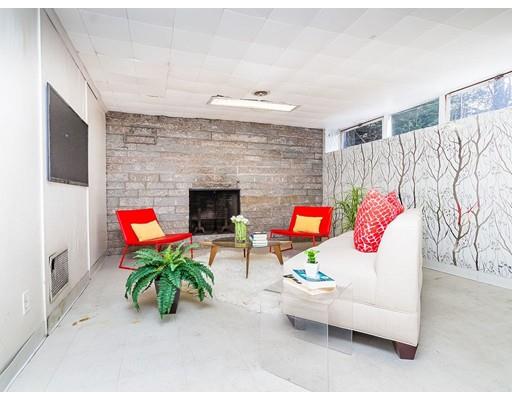 44 Mignon Road Newton, MA 02465 - Photo 17 of 23 a living room with furniture and a fireplace