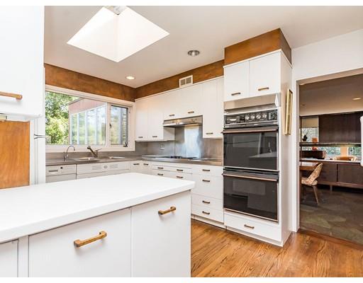 44 Mignon Road Newton, MA 02465 - Photo 7 of 23 a kitchen with stainless steel appliances granite countertop a stove and a sink