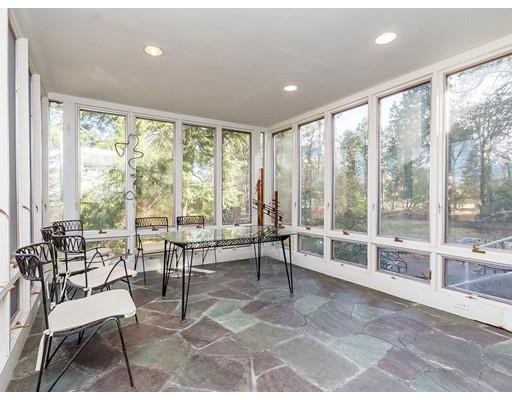 44 Mignon Road Newton, MA 02465 - Photo 9 of 23 a living room with furniture and large windows